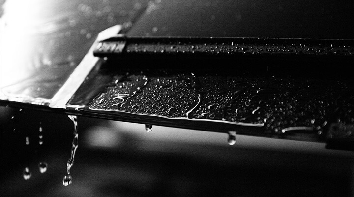 Image of a wiper blade on a rainy windshield